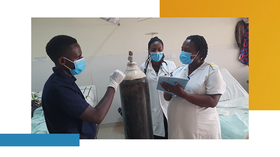 Clinical engineer and nurses next to oxygen cylinder