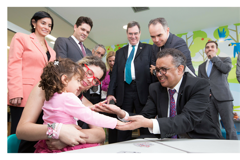 Dr Tedros meeting woman and child in Brazil